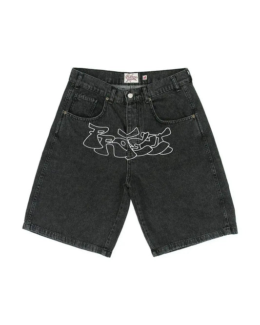 Black denim Graffiti Jorts with a white graffiti-style design and mid-rise waist sits