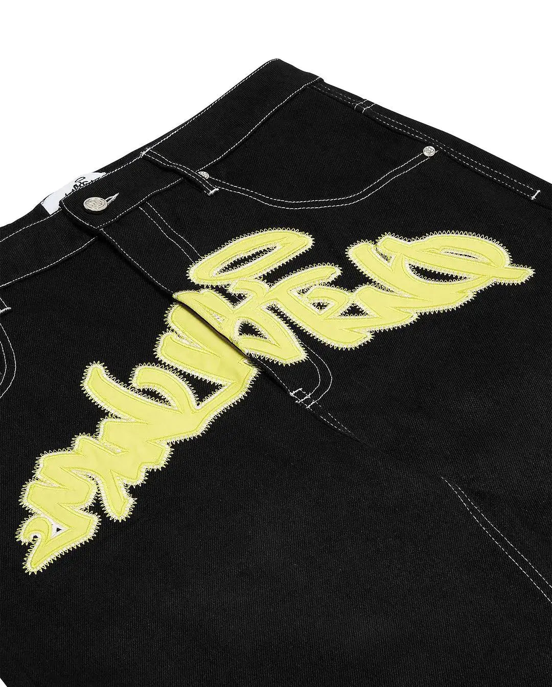 Black denim graffiti shorts featuring yellow text, perfect for Y2K clothing men