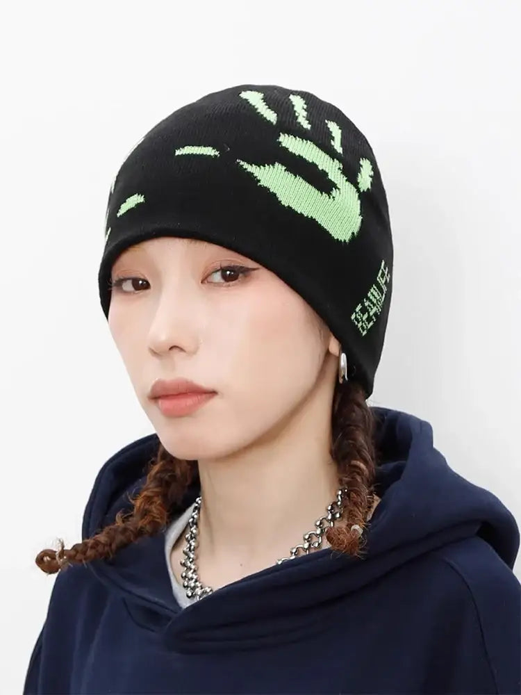 Black knit Graphic Beanie with a glowing green handprint design to stay warm in style