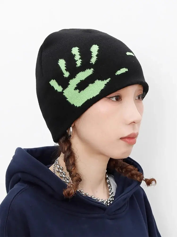 Black knit Graphic Beanie featuring a green handprint design for Y2K style and warmth