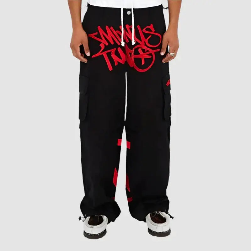 Black graphic pants featuring red graffiti-style design, perfect for Y2K fashion lovers