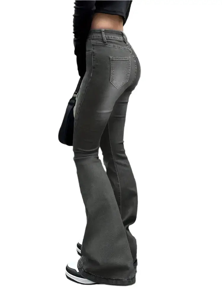 Person showcasing stylish Grey Flare Jeans with a modern flared fit