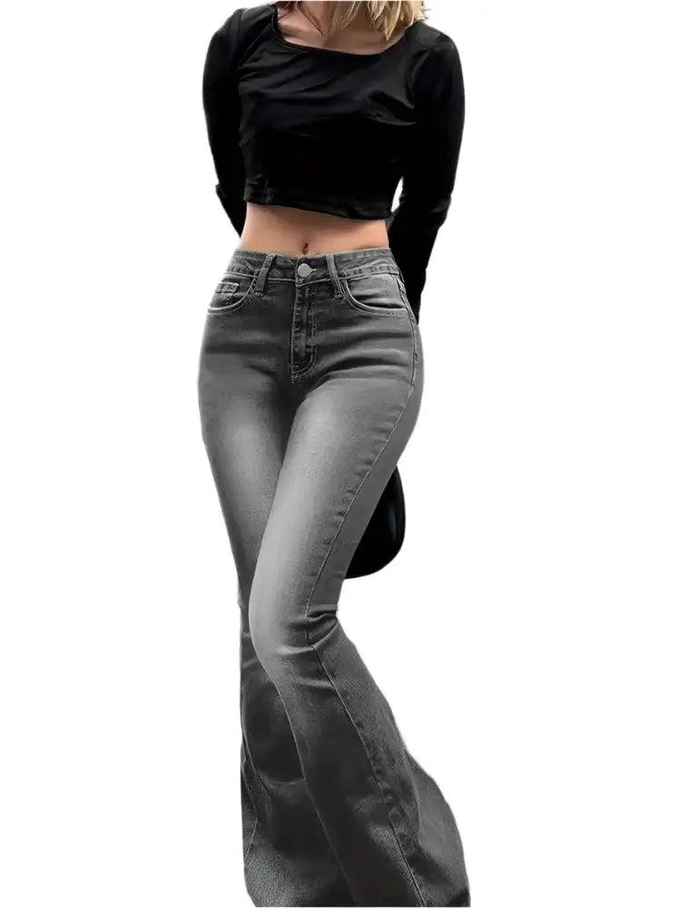 Pair of grey flare jeans styled with a black crop top for a chic look