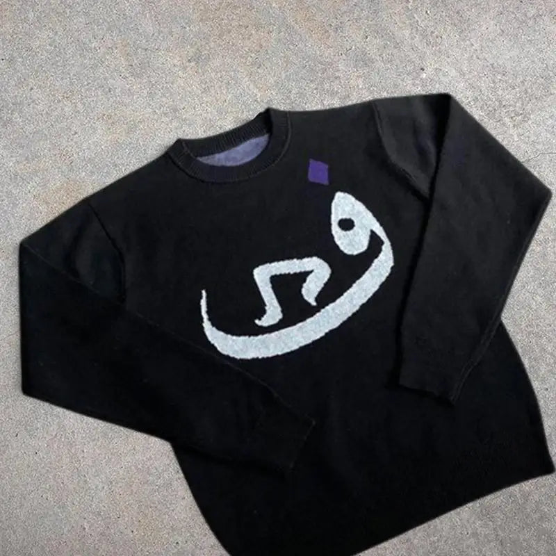 Black Habibi Sweater featuring white abstract face design, perfect for Y2K fashion lovers