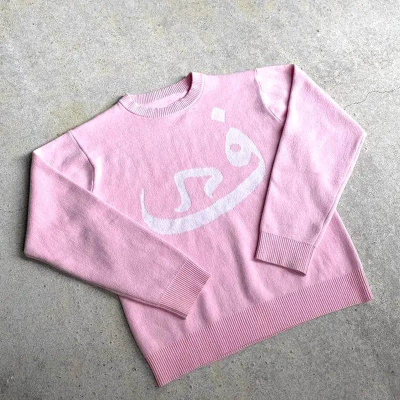 Pink Habibi Sweater featuring a white abstract design, perfect for Y2K fashion lovers