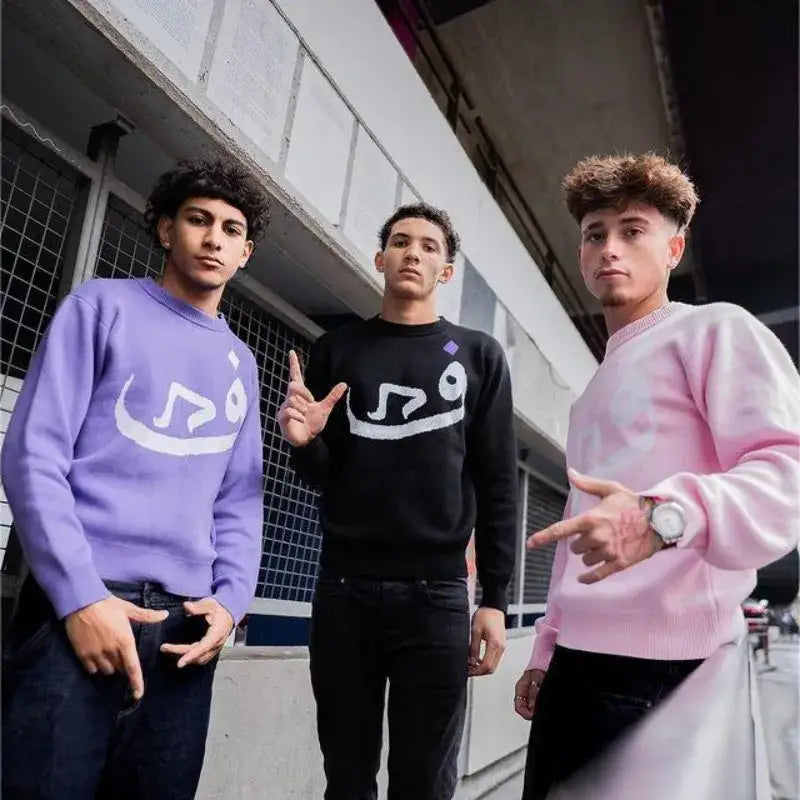 Three young men showcase the stylish Habibi Sweater in trendy Y2K fashion