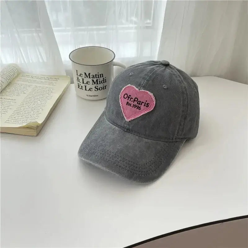 Gray Heart Cap featuring a pink heart patch, perfect for Y2K accessories lovers