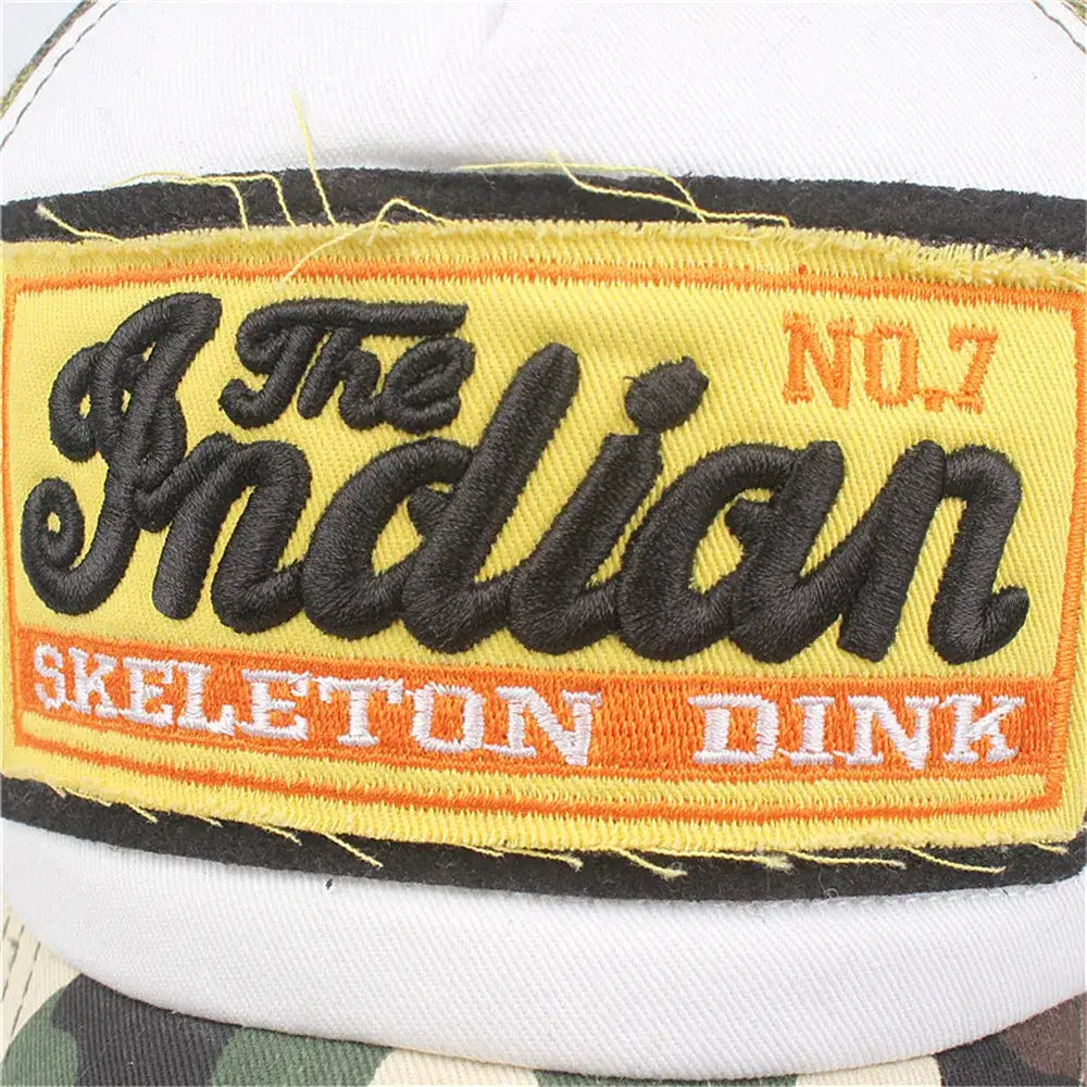 Embroidered patch on Indian Cap featuring The Indian Skeleton Dink No 1 in yellow orange