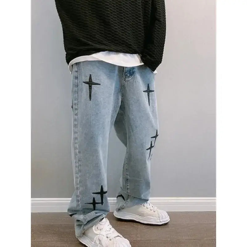 Light blue y2k jeans with black cross designs for a trendy fashion statement