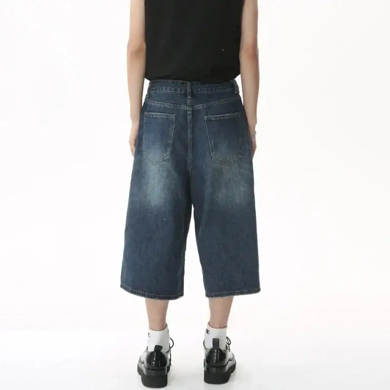 Person wearing Jorts Baggy Y2K wide-leg denim culottes for a trendy look