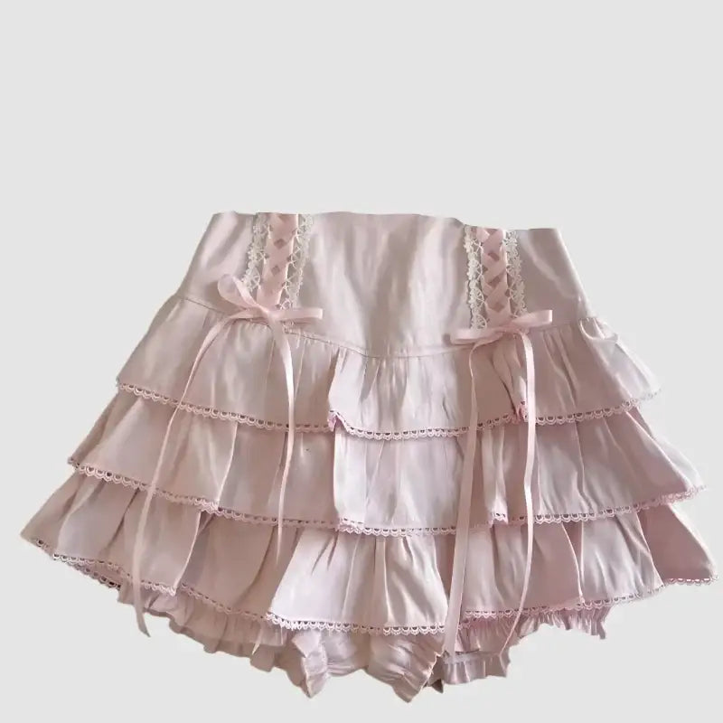 Pale pink ruffled bloomers with lace trim and ribbon bows for a Kawaii Skirt style