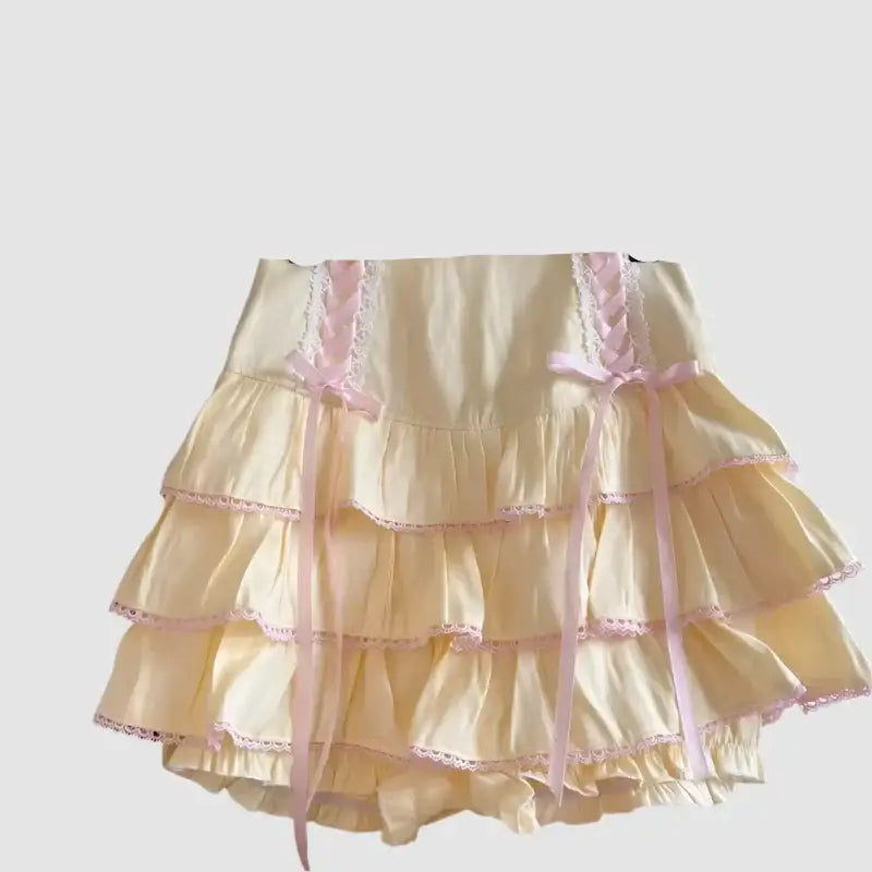 Ruffled cream kawaii skirt with pink lace trim and tiers perfect for Y2K style