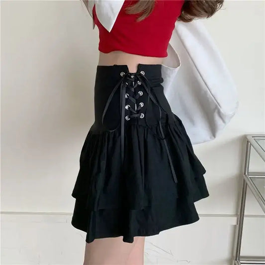 Black tiered mini skirt with lace-up corset-style waistband for a chic Y2K look