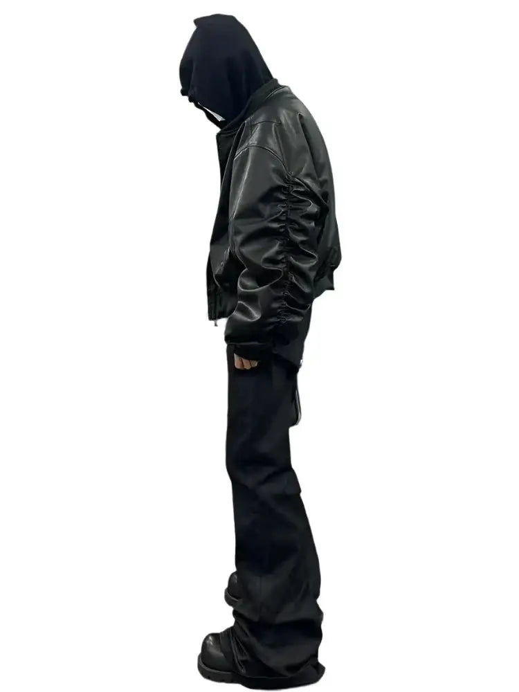 Hooded figure in profile wearing a stylish leather bomber jacket for men