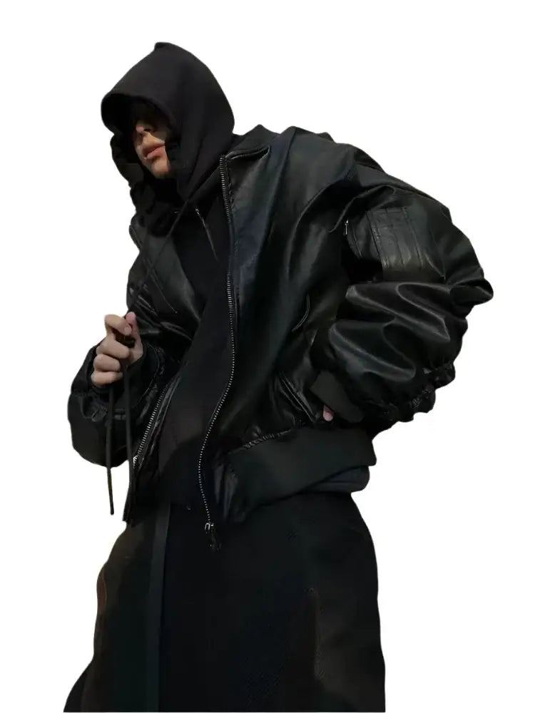 Person showcasing a stylish leather bomber jacket in a black hooded puffer style