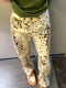 Cream-colored Leopard Print Jeans with stylish brown splotches and stains