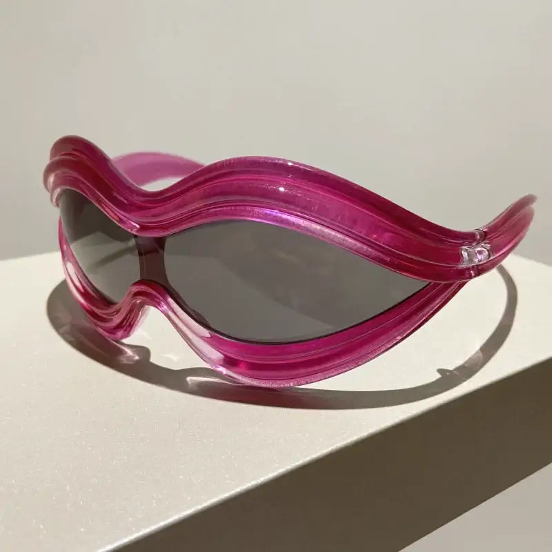 Futuristic pink Lip Sunglasses with wavy design and dark lenses perfect for Y2K style