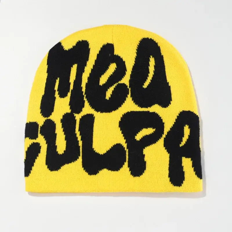 Yellow knit Mea Culpa beanie with black lettering for stylish winter wear