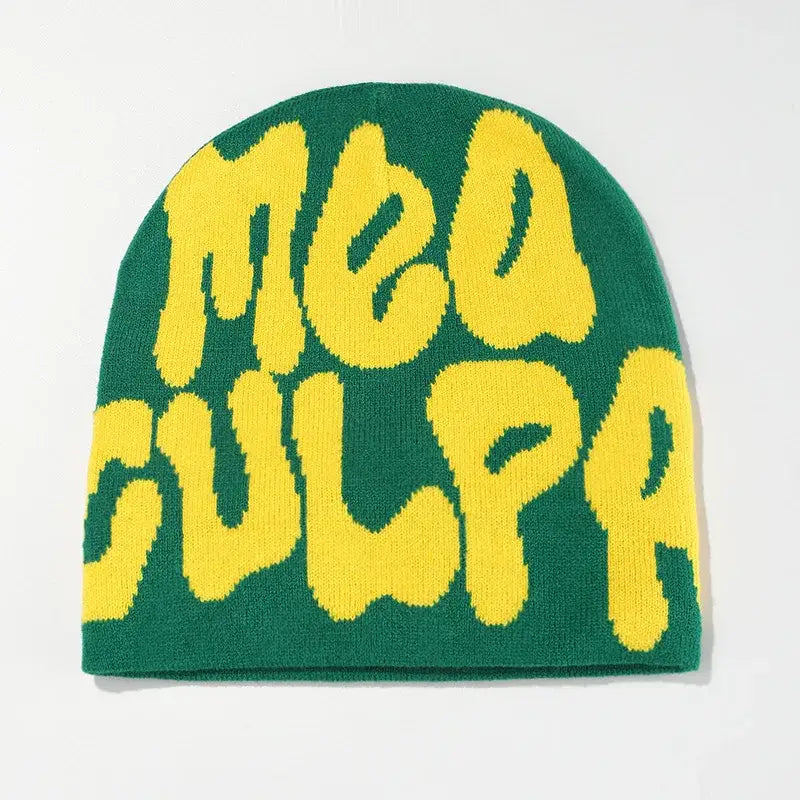 Green Mea Culpa Beanie featuring yellow ’MEA CULPA’ text for stylish winter wear