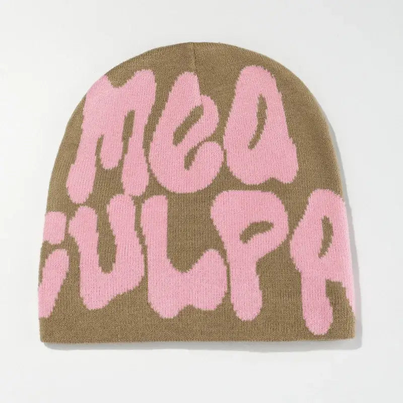 Tan knit Mea Culpa Beanie featuring pink MEA CULPA text for stylish warmth