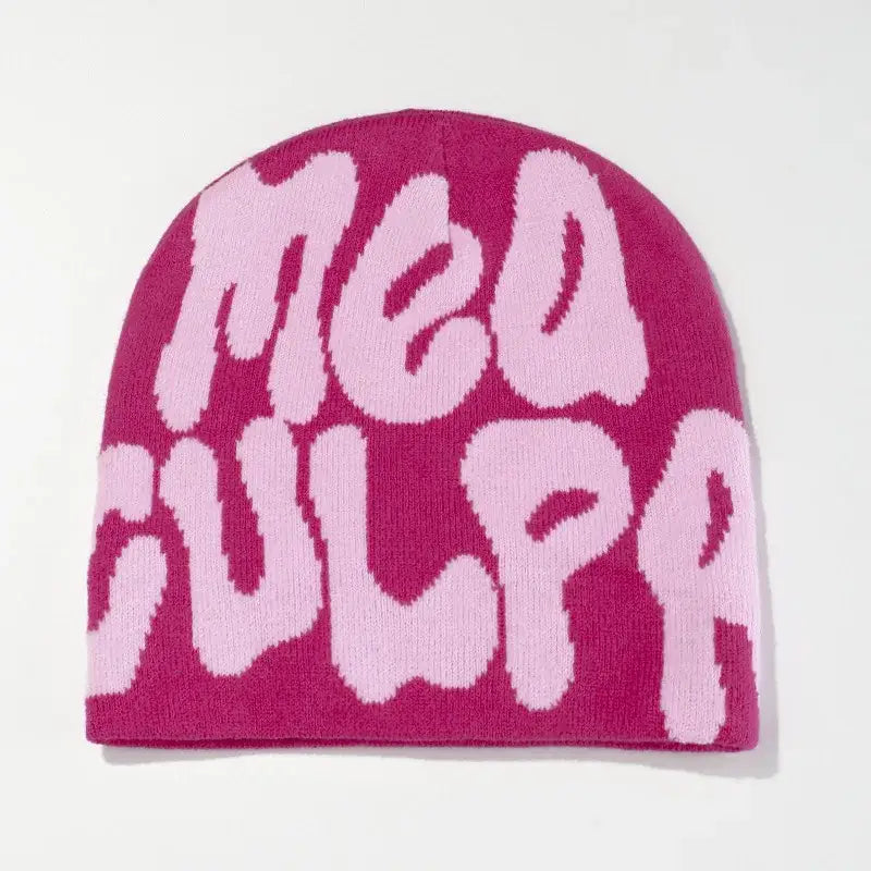 Pink and magenta Mea Culpa Beanie hat featuring Meow text for stylish warmth