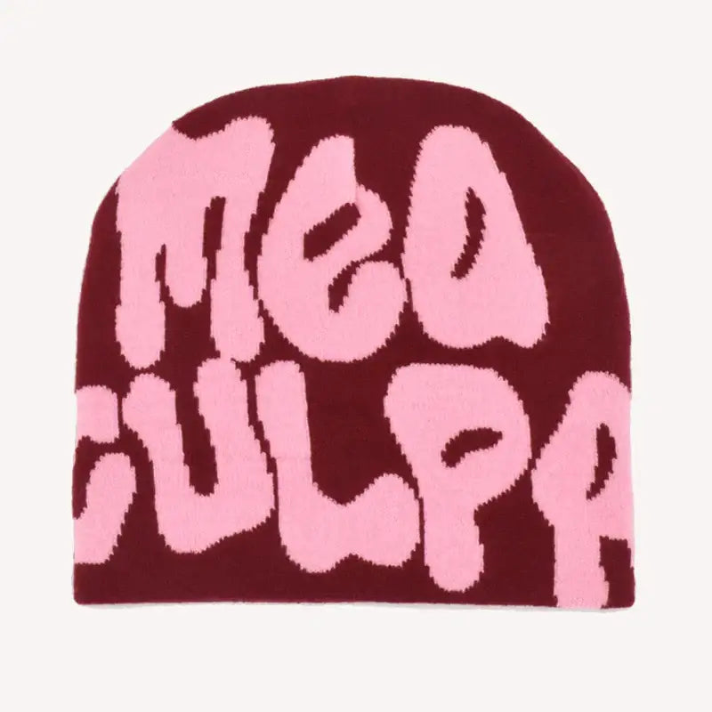 Burgundy knit Mea Culpa Beanie with pink text for stylish winter warmth