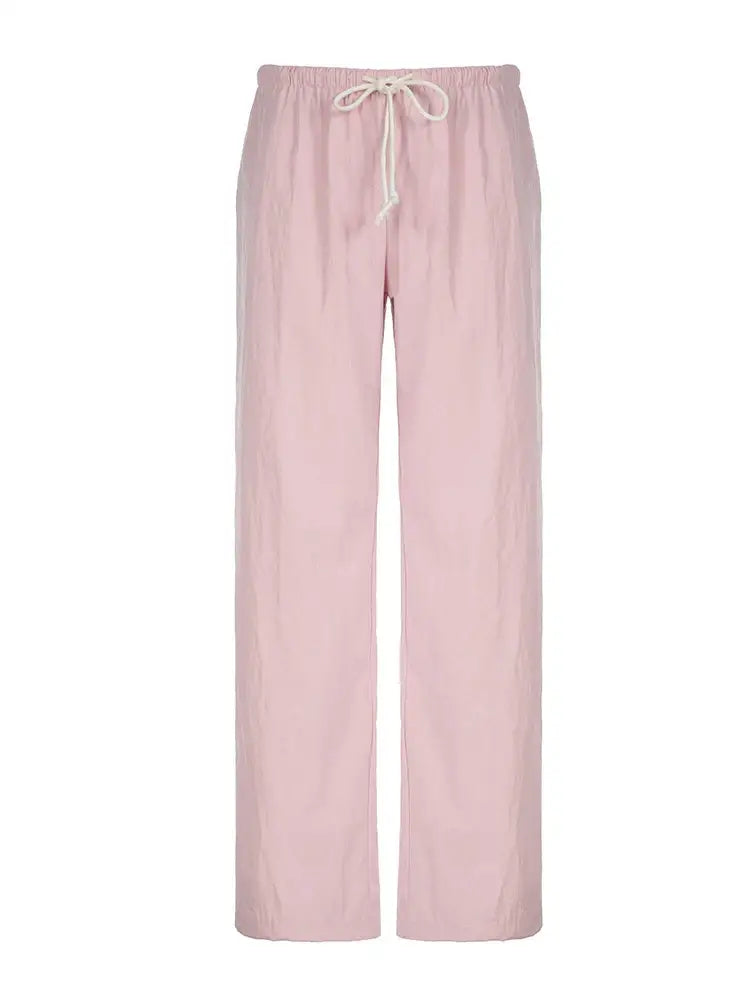 Pale pink lounge pants with a loose fit for ultimate comfort and relaxation