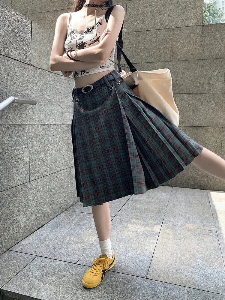 Pleated plaid midi skirt styled with floral top and yellow sneakers for a trendy look