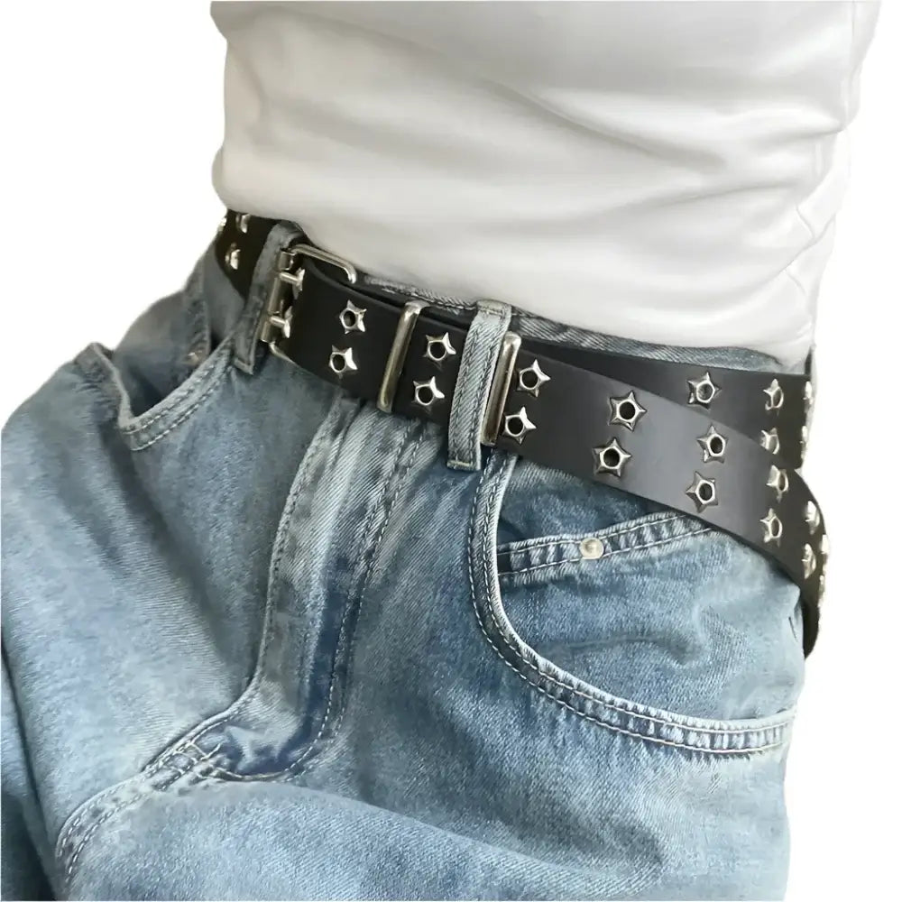 Studded black leather Punk Belt styled with light blue jeans for a trendy Y2K look