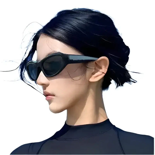 Person with short dark hair in black top wearing stylish Punk Sunglasses with resin lenses