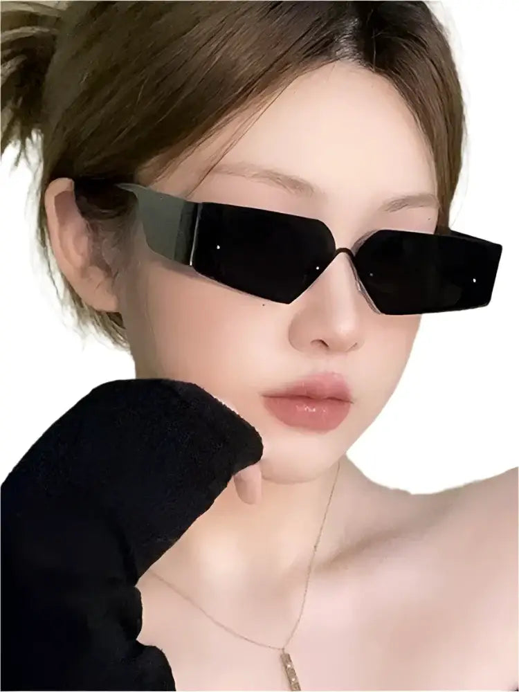 Person with brown hair wearing stylish Retro Geometry Sunglasses in black rectangular frame