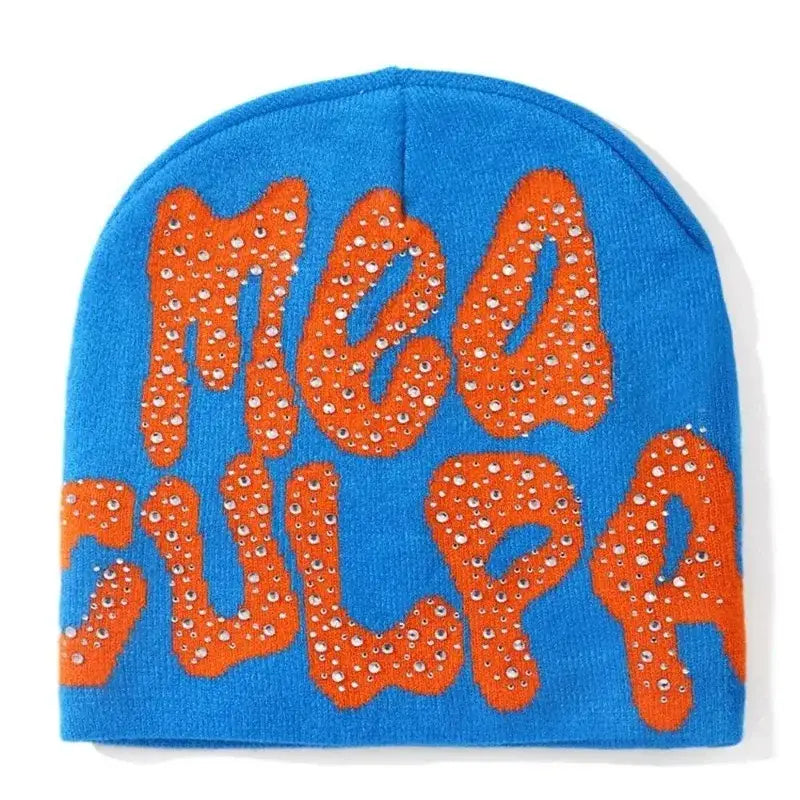 Blue rhinestone beanie with orange MEA CULPA text, perfect for a Y2K fashion statement