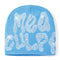 Light blue rhinestone beanie with New Girl written in sparkly lettering y2k fashion statement