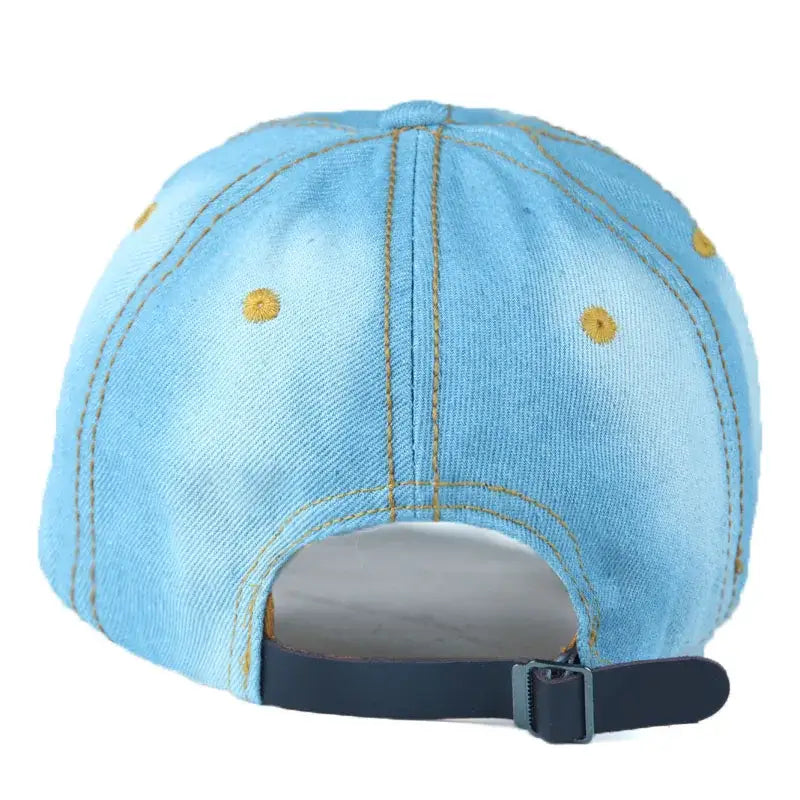 Light blue rhinestone cap with yellow stitching and navy blue adjustable strap