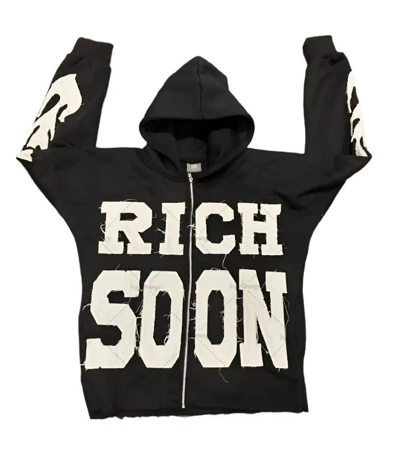 Black zip-up Rich Soon Hoodie featuring bold white ’RICH SOON’ print, perfect Y2K style