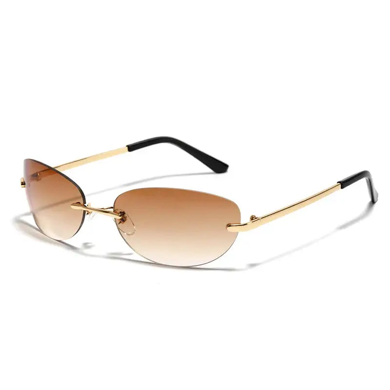 Rimless sunglasses with gold frames and gradient brown lenses showcasing Y2K style