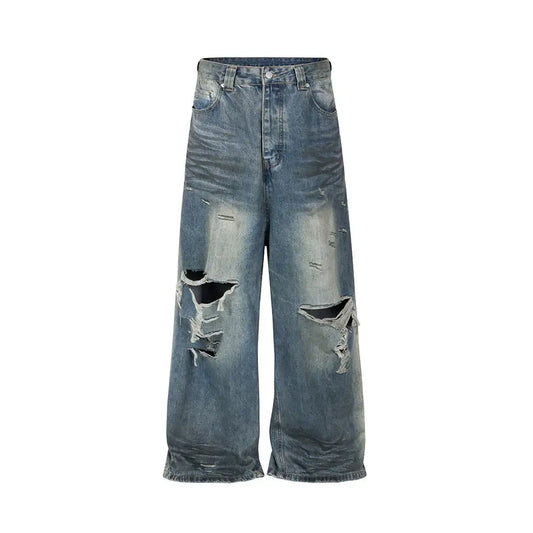 Distressed ripped baggy jeans with wide legs, ripped knees, and frayed hems