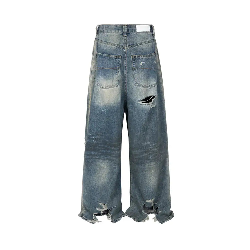 Distressed ripped baggy jeans with frayed hems and stylish rips for a trendy look