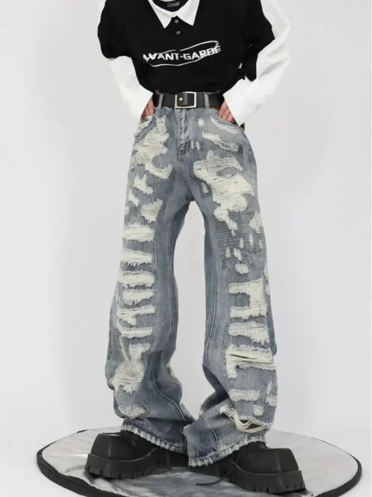 Distressed camouflage ripped jeans men styled with a black t-shirt and belt