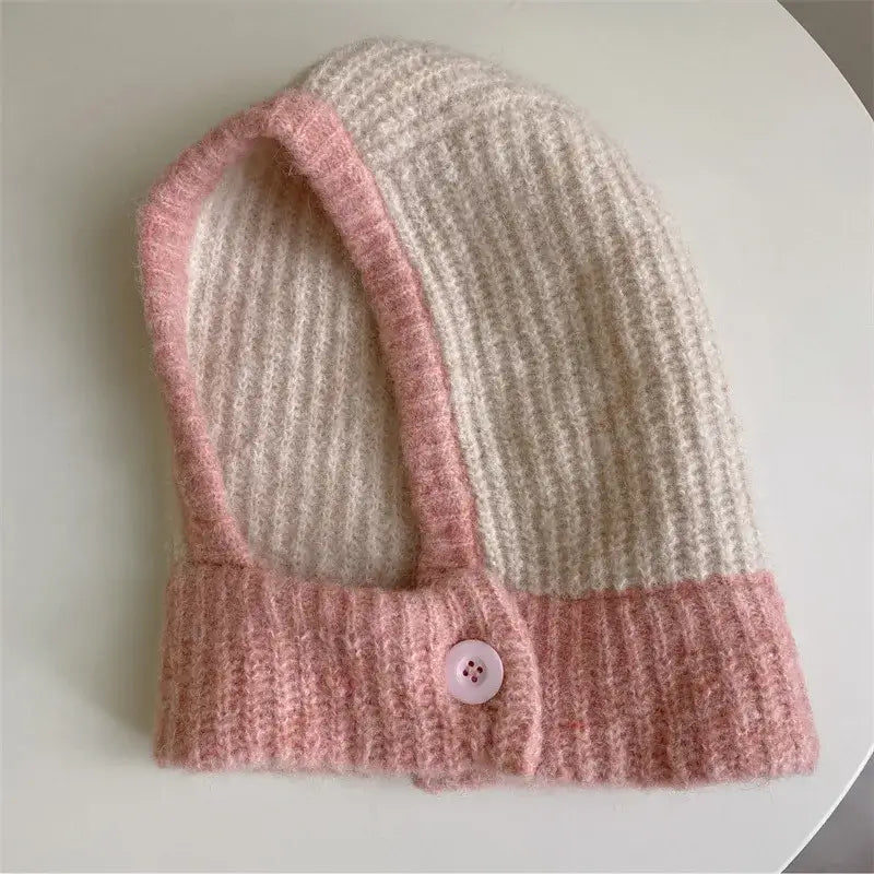 Knitted beanie hat in pink and cream color-blocking for a trendy scarf balaclava look