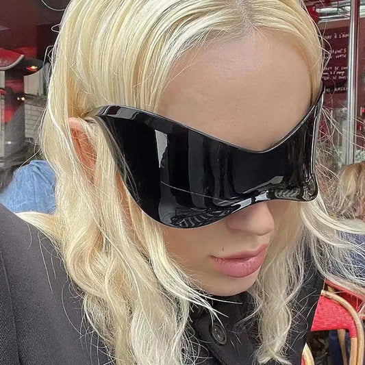 Futuristic Shield Sunglasses worn by a blonde person, perfect for y2k fashion