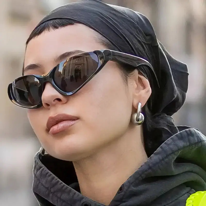 Woman in stylish sunglasses and black headscarf showcasing Silver Glasses Y2K