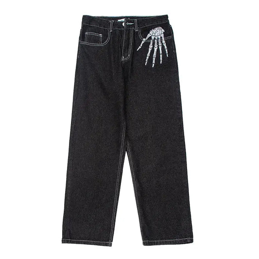 Black denim skeleton pants jeans featuring a unique skeletal hand design on the front