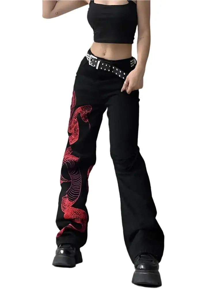 Black wide-leg Snake Jeans featuring a red dragon design and studded belt, trendy Y2K style