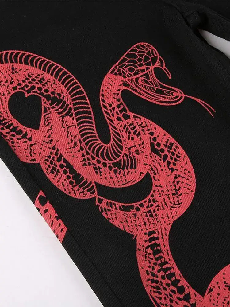 Red snake illustration with detailed scales on black for trendy Y2K Snake Jeans design