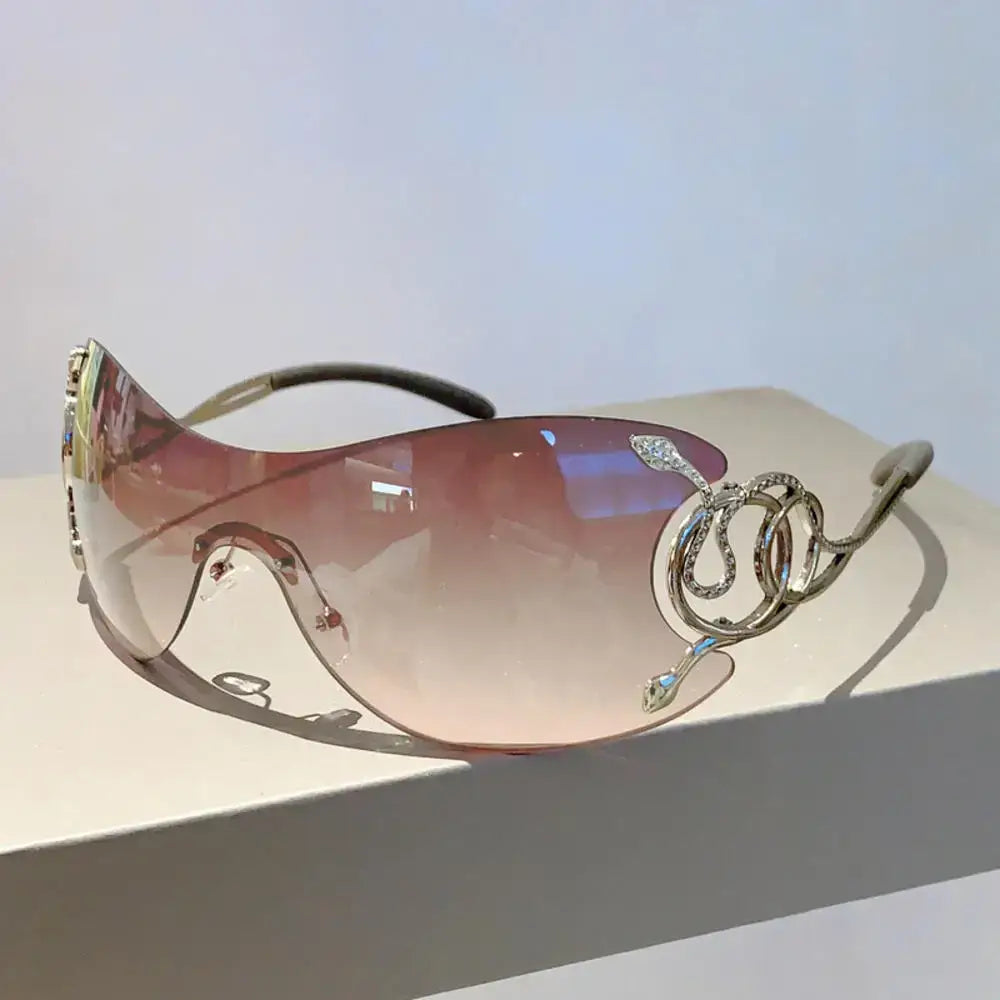 Stylish Snake Sunglasses featuring curved lenses and snake-shaped arms for a Y2K look