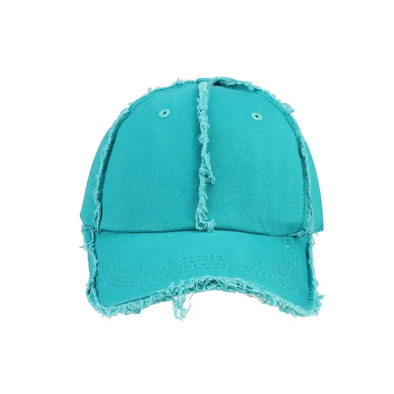 Turquoise snapback cap with frayed edges and visible stitching for a Y2K style