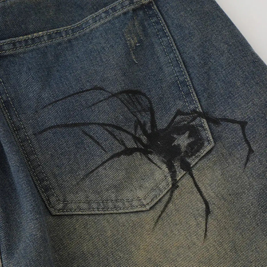 Spider design on denim fabric, showcasing stylish Spider Web Shorts pocket detail