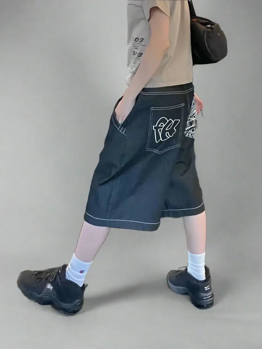 Baggy denim street style shorts featuring a white logo on the back pocket