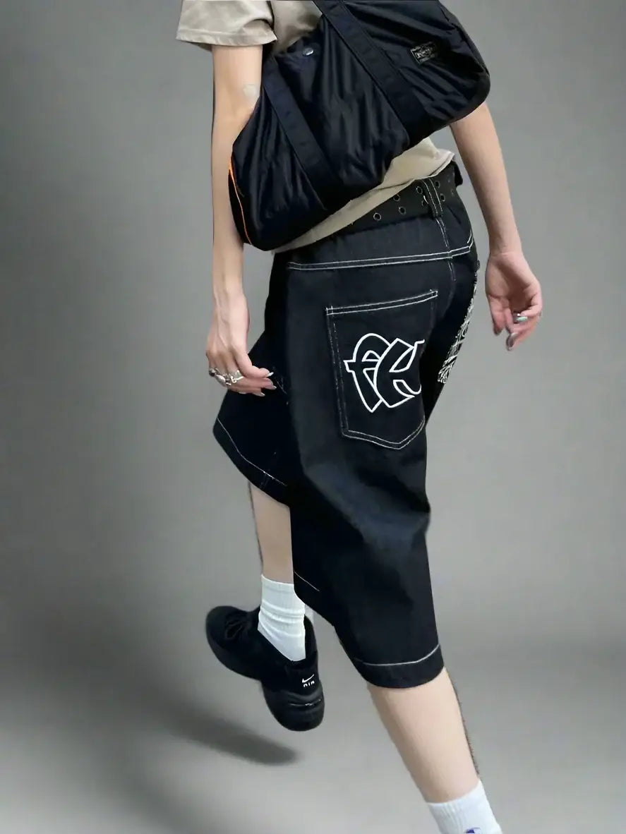 Dark denim capri pants with white design, perfect for street style shorts fashion